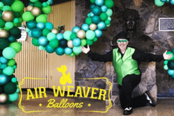 Man with large balloon arch