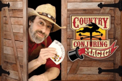 Magician showing deck of cards and leaning out of barn door