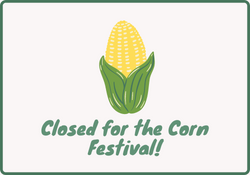 An ear of corn with the words "Closed for Corn Festival"